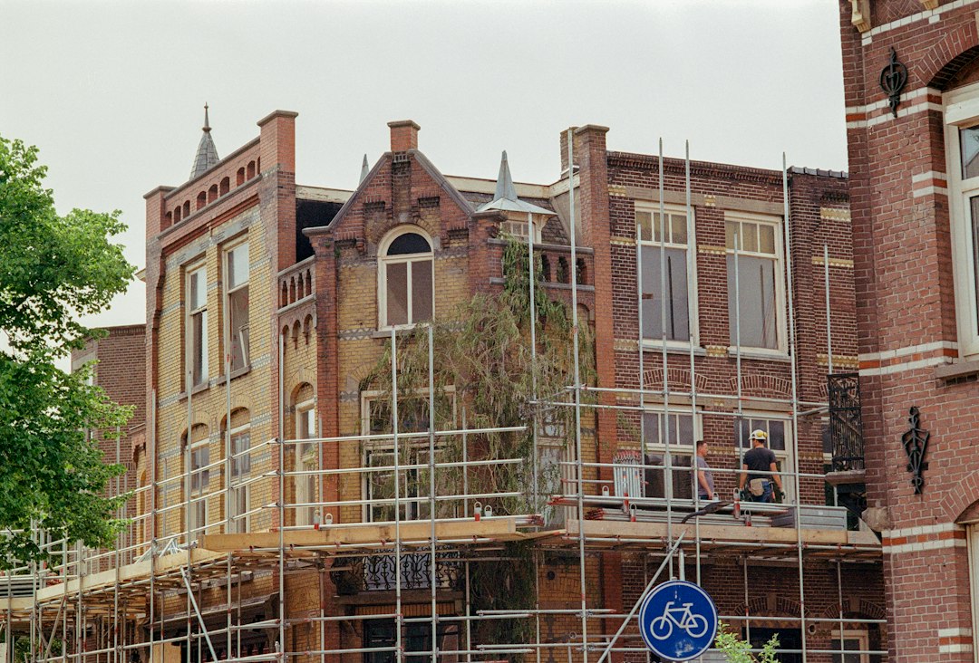 Best Country for Working Visa from Nepal in 2026: A Side-by-Side Comparison 2 Construction site with scaffolding in Europe, a common workplace for Nepali workers on a European working visa